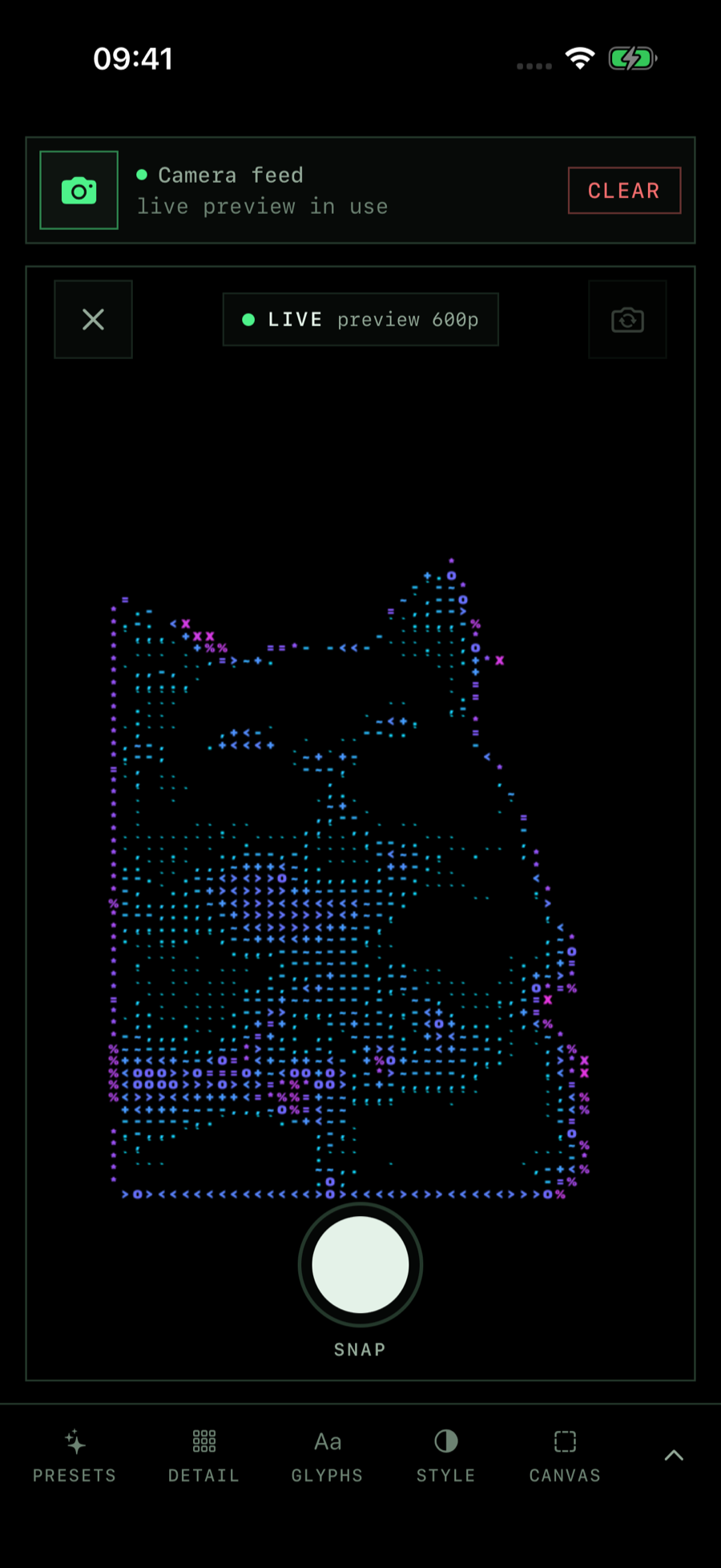 The Image ASCII iPhone app showing the live camera preview rendering a white cat as cyan and violet ASCII in the Neon look.